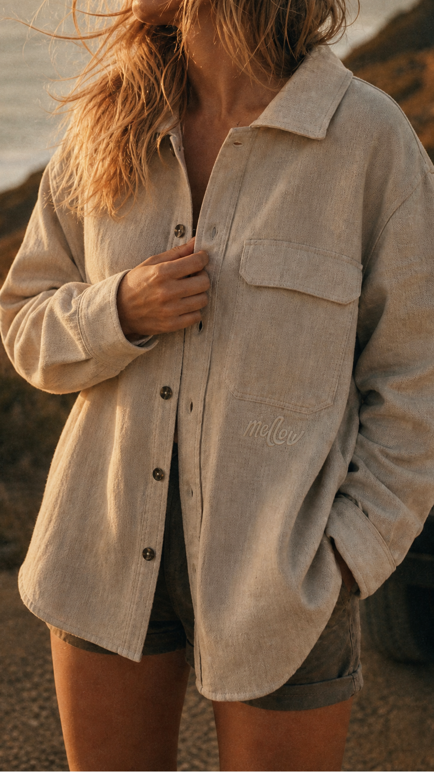 Person wearing a beige Hemp shirt with a blurred natural background
